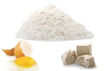 Flour,egg and Yeast cubes close up on the white