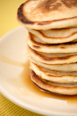 Hot pancakes with maple syrup