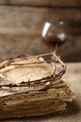 Fototapeta na wymiar Crown of thorns and bible on old wooden background