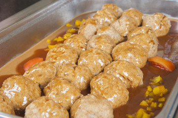 Row of dumplings at a restaurant buffet