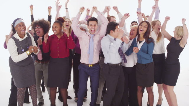 Happy mixed ethnicity group jumping for joy on white background in studio shot