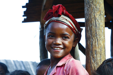 Very pretty malagasy child smiling in the vilage- poverty