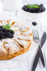 apple pie with fresh blackberry and icing shugar