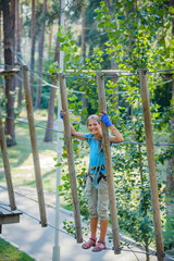 Girl in a climbing adventure park