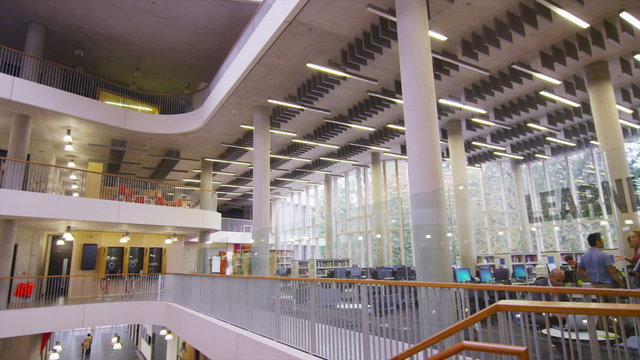 Diverse group of students in large modern university building
