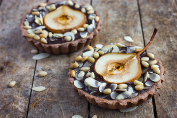 chocolate tartlets with pear and nuts