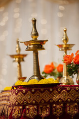 Vilakku lamps used as decorations at a Hindu Indian wedding