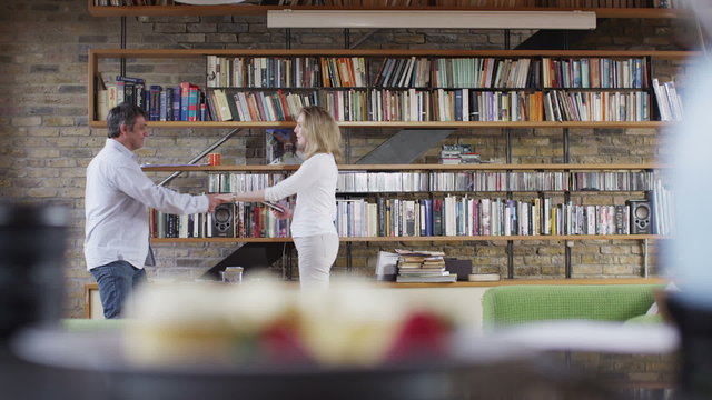 Romantic couple dancing together in the living room
