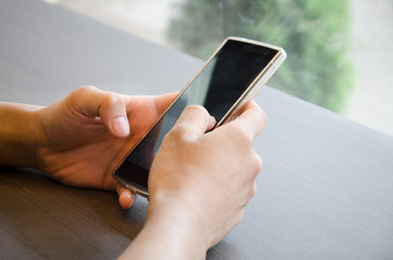 Close up of a man using mobile smart phone