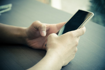 Close up of a man using mobile smart phone