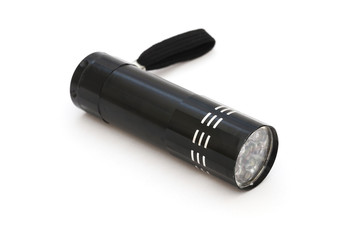 small black LED flashlight on white background