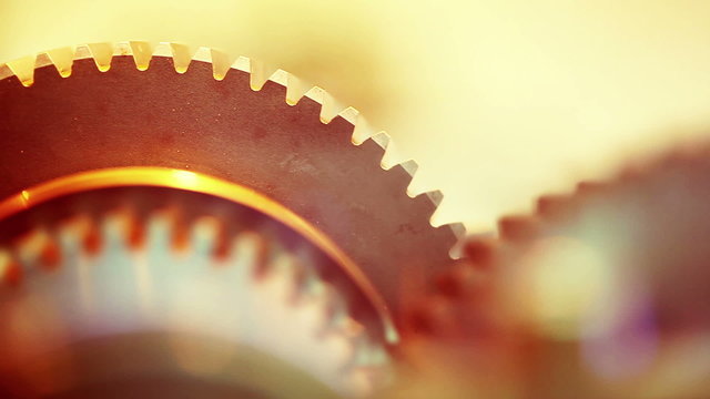 Golden gears with cogs in action. HD 1080p, Loop-ready