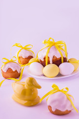 Decorated easter cakes and eggs  in yellow colors. Selective foc
