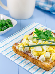 Breakfast sandwich with chopped eggs and verdure