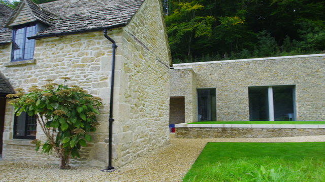Exterior view of a traditional English cottage with contemporary built extension