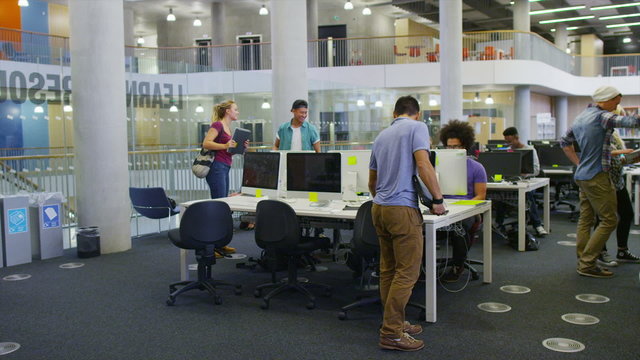 Diverse group of students in large modern university building