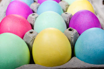 Egg carton of colorful dyed Easter eggs