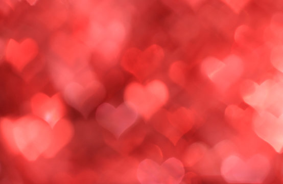Abstract red background with heart-shaped boke