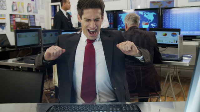 Bored and sleepy businessman struggles to stay awake at work