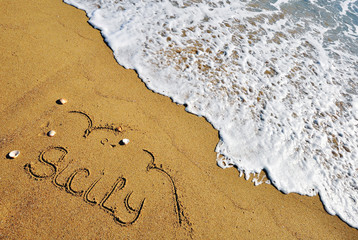 Sicily sign on the beach