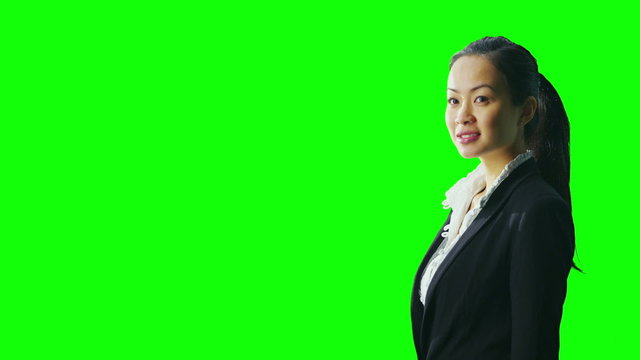 Portrait of attractive successful businesswoman on green screen background