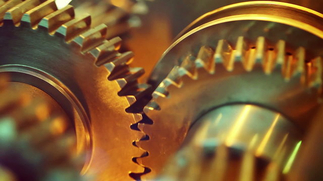 Golden gears with cogs in action. HD 1080p, Loop-ready