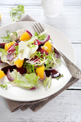 beets and oranges in salad on plate