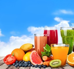 Fruit. Glasses of fruit and vegetable juice with fruits on a