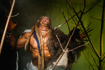 Vicious werewolf with a skin on his shoulder and long nails amon