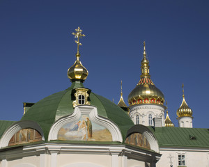 Fototapeta na wymiar Domes and crosses pravoslanoy church in Ukraine