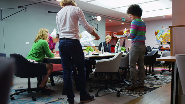 Time Lapse Of Hard Working Casual Business Team At Work In Creative Office