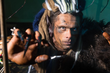 Close-up portrait of a man with dreadlocks in the skin