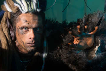 Close-up portrait of a man with dreadlocks in the skin