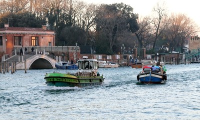 two boats for transporting goods in venice