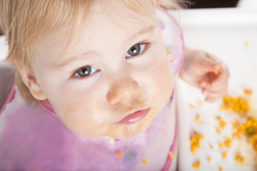looking baby eating