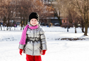 Fototapeta na wymiar Portrait of little girl outdoors in winter