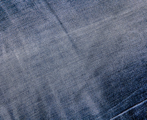 Texture of blue jeans textile close up