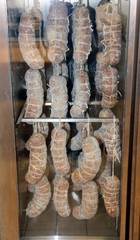 sausages and cured meats in industrial fridge during the seasoni