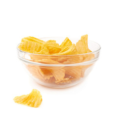 Multiple potato chips in a glass bowl