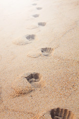 Footprints on the sand beach