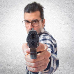 Posh boy shooting with a pistol