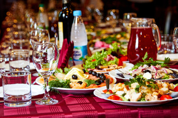Obraz na płótnie Canvas Set a party table with food and drinks