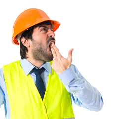 worker making suicide gesture