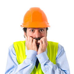 Frightened workman over white background