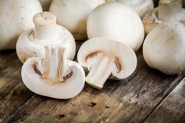 raw mushrooms on a rustic table close up