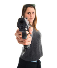 Girl shooting with a pistol