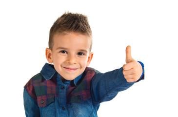 Kid with thumb up over white background