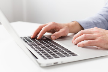 Fototapeta na wymiar Close-up photo of man working with laptop computer