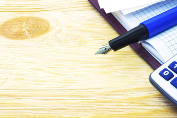 Fountain pen and notebook on the table