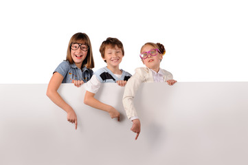 Portrait of happy children with white blank